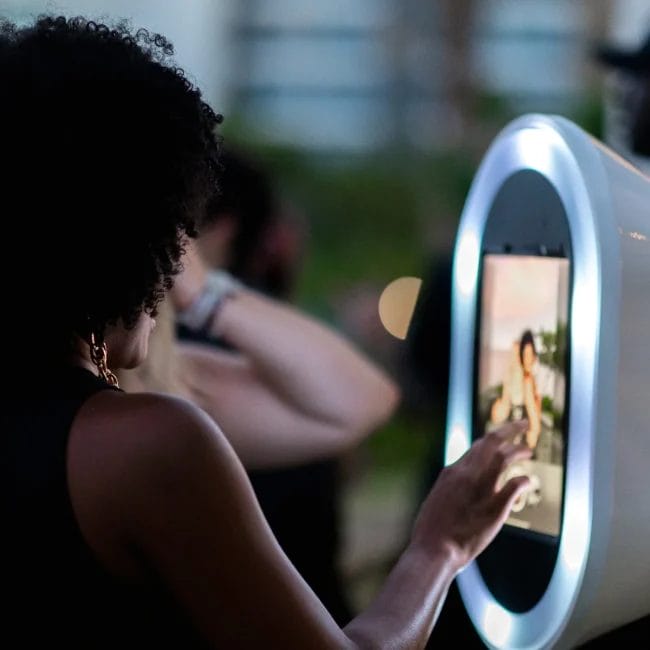 Guest enjoying a modern photo booth experience at a Detroit event