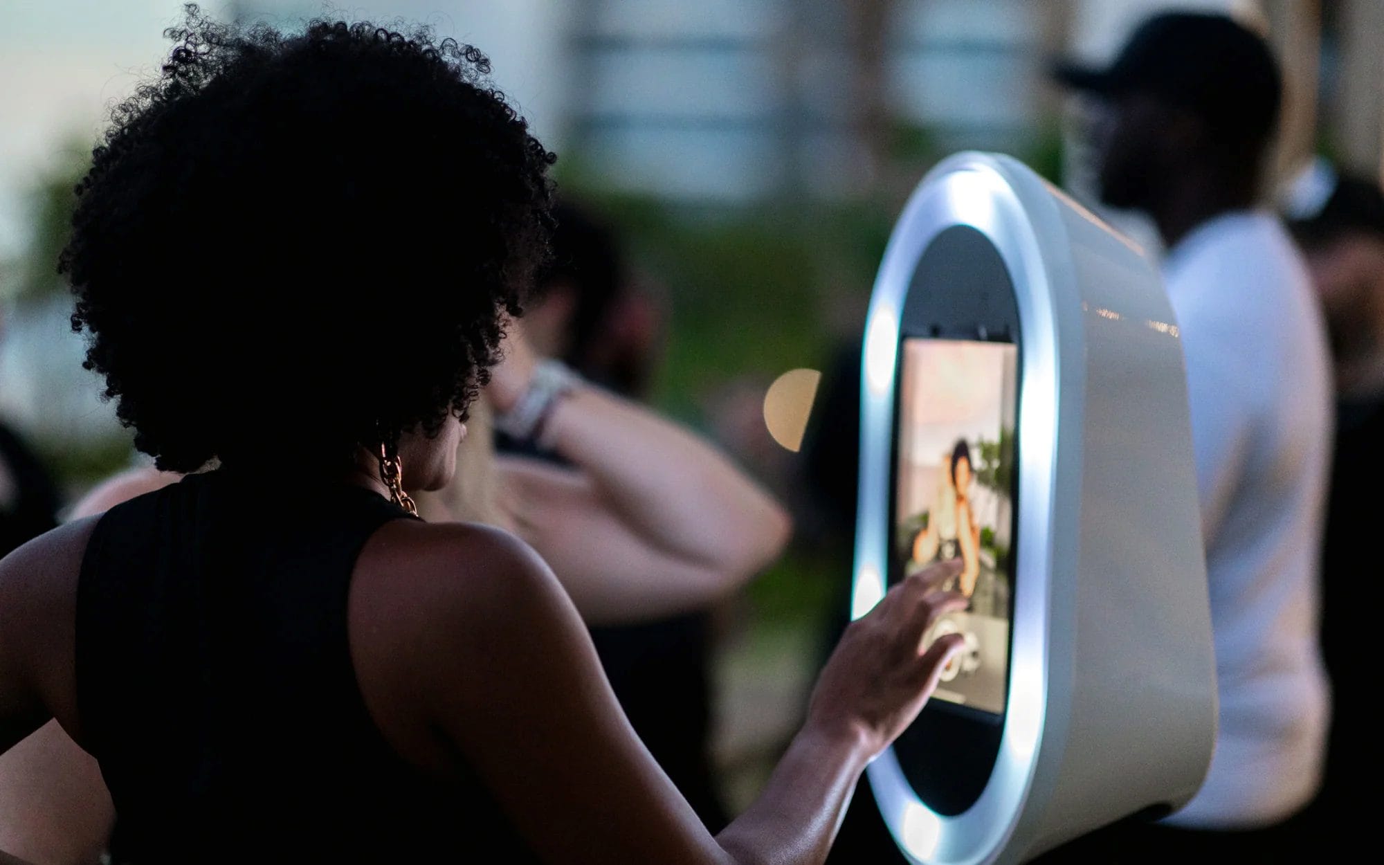 Guest enjoying a modern photo booth experience at a Detroit event