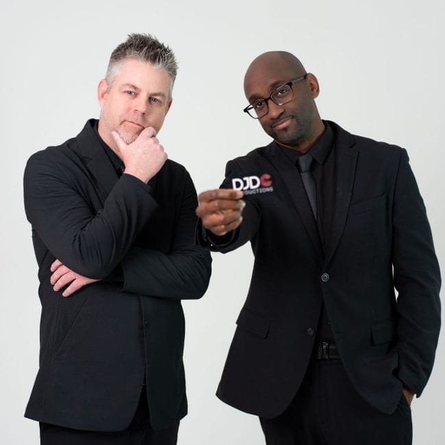 Abay Israel and Derrick Castenholz of DJDC Productions standing together at an Ann Arbor event