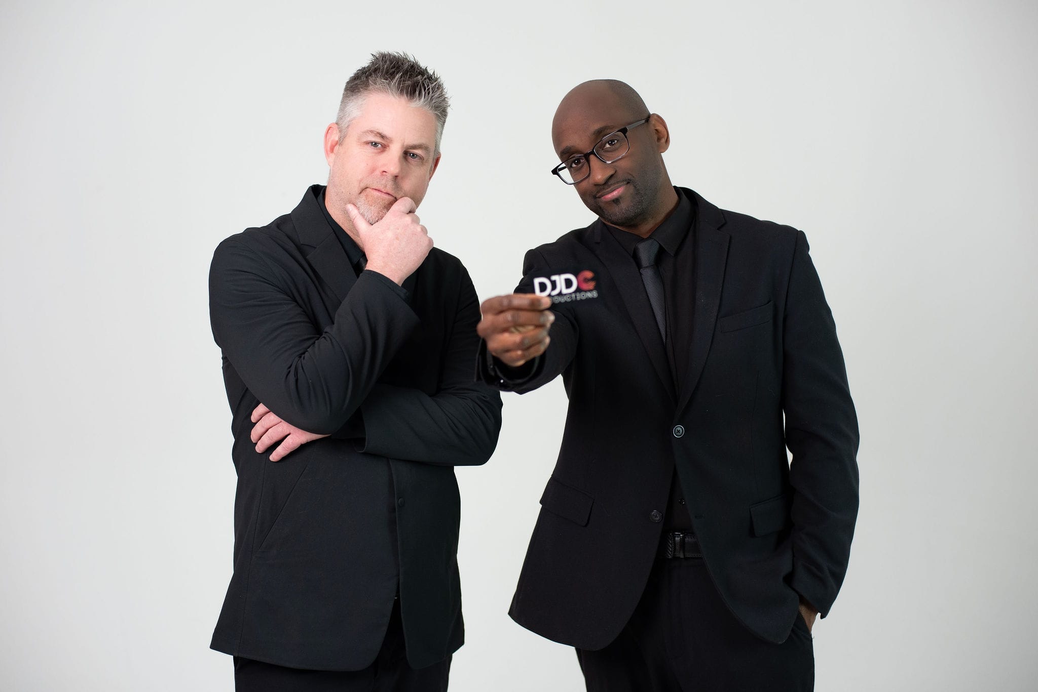 Abay Israel and Derrick Castenholz of DJDC Productions standing together at an Ann Arbor event