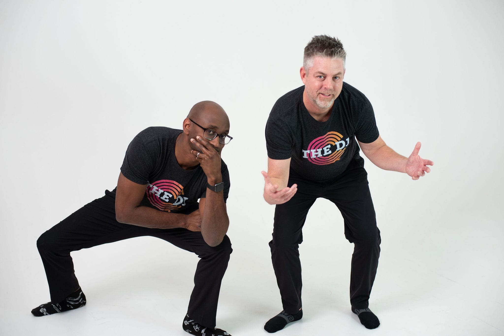 Abay Israel and Derrick Castenholz of DJDC Productions standing together at an Ann Arbor event